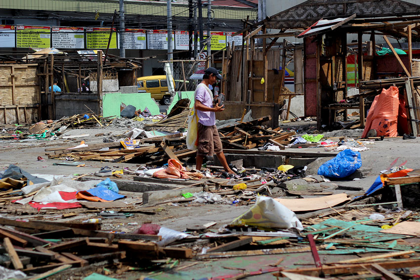 Demolished establishments in Ponciano street are favorite sites for residents like this man who looks for useful things for recycling. (Ace R. Morandante/davaotoday.com)