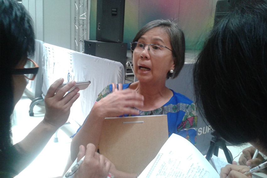 Engineer Carolina Angel, OIC of the National Housing Authority Region 11, explains to reporters the delay of constructing 17,000 houses for Typhoon Pablo survivors due to lengthy time to get clearances from government. (Tyrone A. Velez, davaotoday.com)