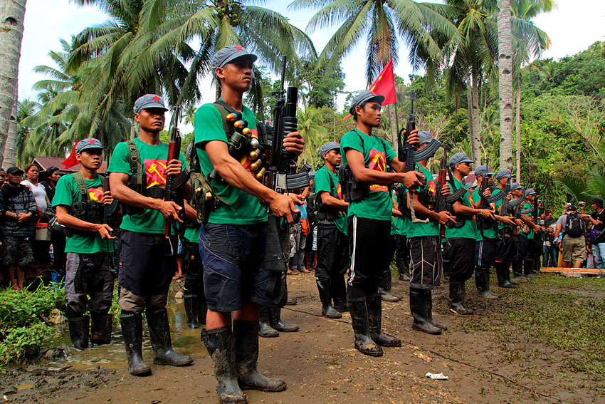 Guerillas of the New People's Army go into formation to start the program of the 46th founding anniversary of the Communist Party of the Philippines somewhere in  Surigao del Sur. (Ace R. Morandante/davaotoday.com)