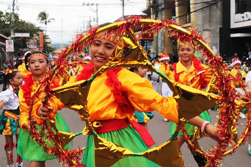 Public school students in colorful costumes are among the participants during the Pasko Fiesta parade held at the Rizal Park, Friday. (Medel V. Hernani/davaotoday.com)