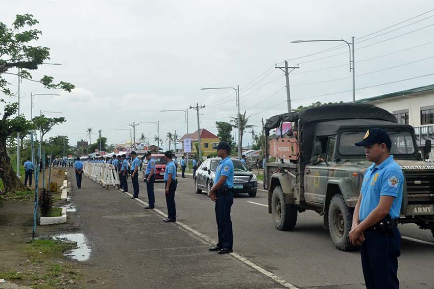 Police forces line up along Daniel Z. Romualdez Airport in Tacloban City up to Palo, Leyte highway in a dry run Wednesday as preparation for the security measures on the visit of Pope Francis. (Contributed Photo by Ronnie C. Clarion)