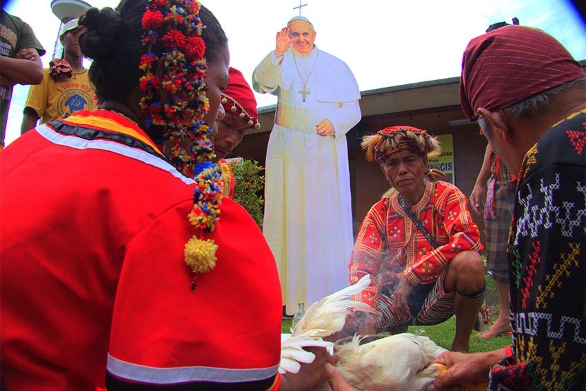 Leaders of various indigenous people’s tribes perform a ritual called panubadtubad before an image of Pope Francis as they confer on him the honorary title Apo (Elder) Edsila, meaning ‘light,’ ‘sunrise’, or ‘dawn of a new day. (Contributed photo)