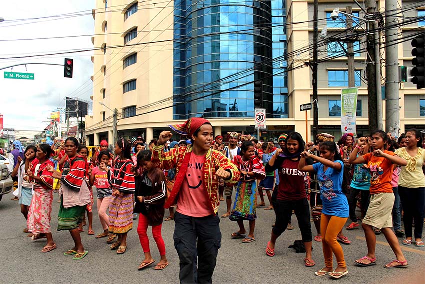 Lumad women and men join the One Billion Rising dance campaign along Roxas and C.M. Recto Streets.