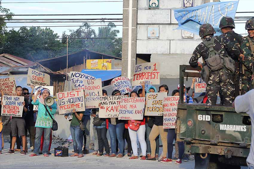 Moro group protests in front of army camp for "coddling"  US troops who were allegedly responsible for leading the botched Mamasapano operation. News reports say US troops "funded" the operation whick killed 44 police commandos, 18 MILF rebels and seven civilians (Contributed photo by Kilab Multimedia)