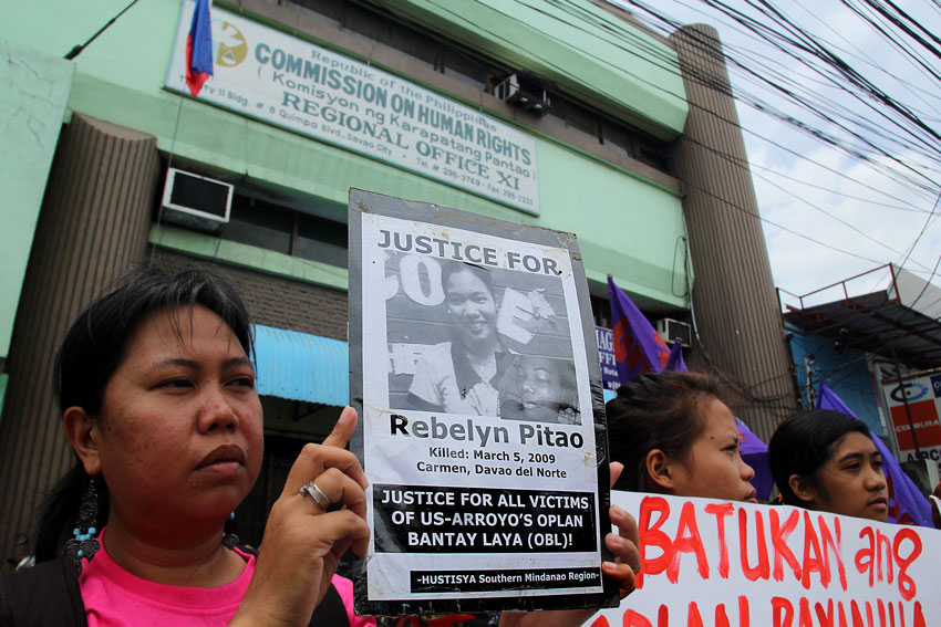 Members of the women's group Gabriela picket outside the Commission on Human Rights office in Davao City to demand explanation why there had been no arrest yet of the killers of Rebelyn Pitao, daughter of guerrilla leader Ka Parago. Pitao was killed on March 5, 2009 while she was going home after a days work at a public elementary school outside the city.  (Ace R. Morandante/davaotoday.com)