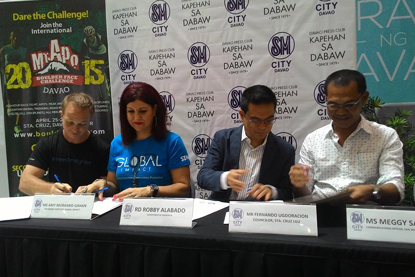 The Department of Tourism, the local government of Sta. Ctuz,  Davao del Sur with anti-human trafficking group, Global Impact, sign an agreement to host the 2015 International Mt. Apo Boulder Face Challenge during a press briefing on Monday. (davaotoday.com)