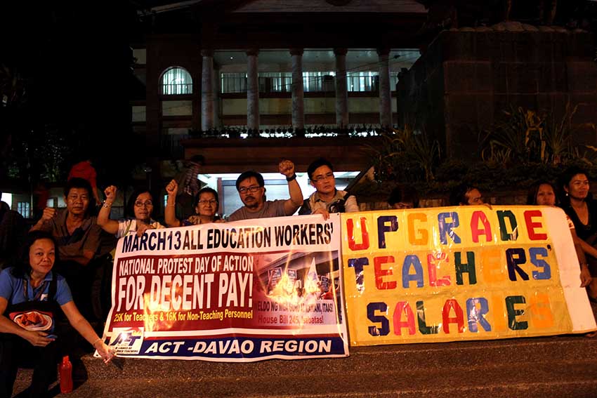 Members of the Alliance of Concerned Teachers (ACT) in Davao join the national day protest national day of action of teachers along San Pedro street on Friday (March 13). Elenito Escalante, ACT president, said they call for decent wage as they work more than eight hours a day without overtime pay. (Medel V. Hernani/davaotoday.com)