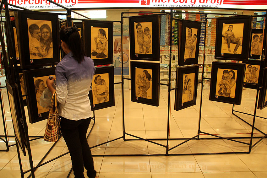 Engr. Manuel A. Medros, a local artist, exhibits his sketches of women as a tribute to the 105th International Women's Day. The exhibit will run until Friday at a mall along JP Laurel Street. (Ace R. Morandante/davaotoday.com)