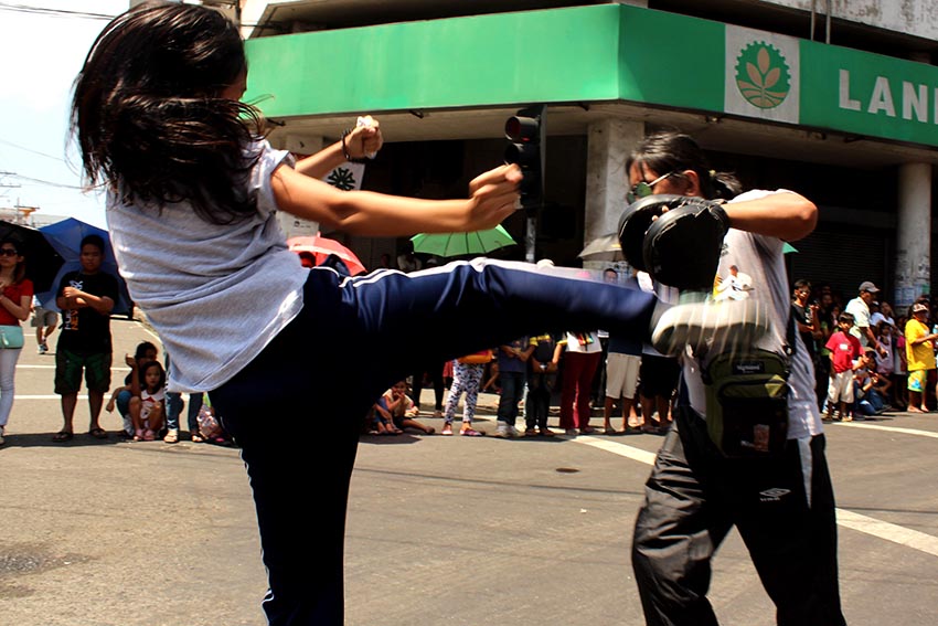 Martial artists display their skills along C. M. Recto corner Bonifacio street during the 78th Araw Ng Dabaw civic parade. (Medel V. Hernani/davaotoday.com)