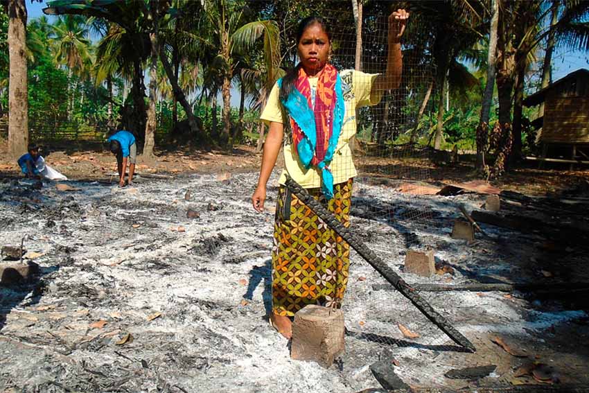 A resident of Sitio Tampat, Brgy. Pamalian, Shariff Aguak, Maguindanao shows what's left of her house after members of the 8th Marine Battalion Landing Team (MBLT) of the armed forces allegedly burned it. Moro rights group Suara Bangsamoro said that the MBLT stayed in the community for two weeks burned nine houses and two mosques in various villages in Maguindanao last March 18. (Contributed photo)