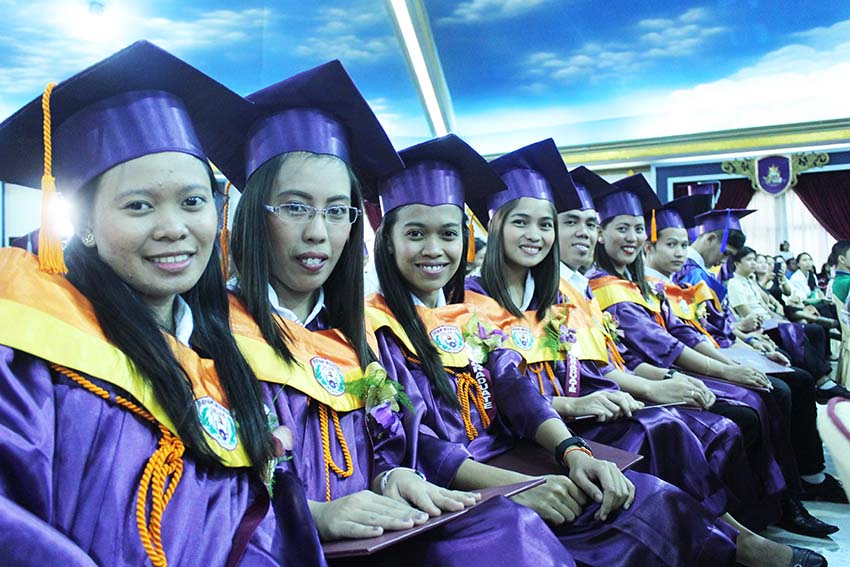 Graduates of a college along Catitipan highway here flash their smiles despite uncertainty in their future.  Davao Region posted an unemployment rate of 6.5 percent and underemployment rate of 20.2 percent. (Medel V. Hernani/davaotoday.com)