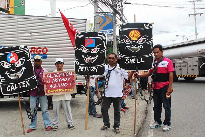 Militant transport group, Transmision-Piston protests in front of the oil depot in Km.10, Sasa to demand a big time price rollback in petroleum products. (Medel V. Hernani/davaotoday.com)