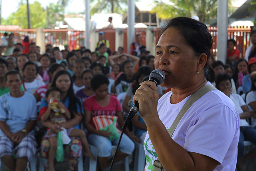 Josephine Ata, a leader of the San Antonio Village Association Inc. questions the quality of the houses given by the government to the Typhoon Pablo survivors during the turnover ceremony of the houses at the municipalityof Compostela. She said that the houses have weak foundation and uses low quality materials. (Ace R. Morandante/davaotoday.com)