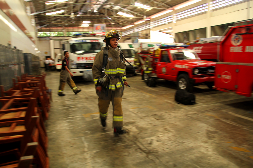 A member of the Central 911 firefighters jogs wearing his fire suit that weighs 25 kilogram within the Central 911 office. The officer said they jog everyday as part of their training. (Ace R. Morandante/davaotoday.com)