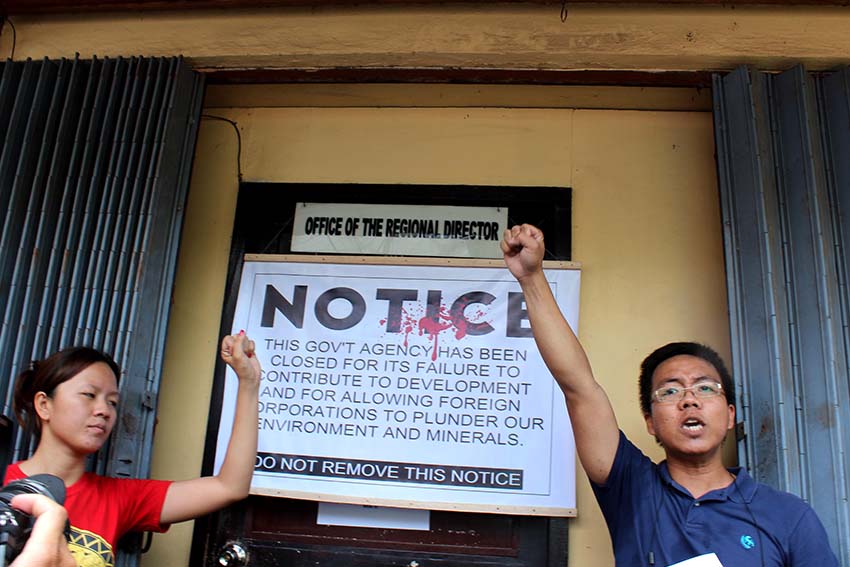 Sheena Duazo of Bagong Alyansang Makabayan and Prof. Kim Gargar of Panalipdan served the closure notice at the office of the Mines and Geoscience Region XI Director on Tuesday. 