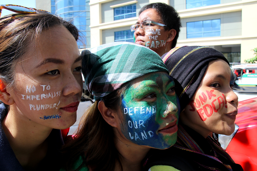 Davao activists paint their faces to protest large scale mining operation and "imperialist plunder" of ancestral lands during the celebration of Earth Day. The activity was spearheaded by Bagong Alyansang Makabayan and Panalipdan.   (Ace R. Morandante/davaotoday.com)