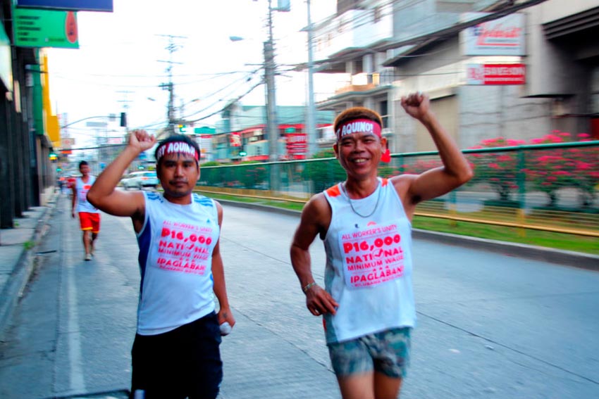 Workers join the 4-kilometer fun run calling for  P16,000 national minimum wage. The activity, led by labor group Kilusang Mao Uno, started at Magsaysay Park and ended in Rizal Park. (Ace R. Morandante/davaotoday.com)