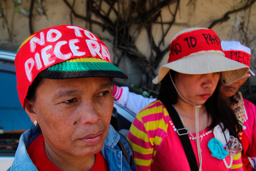 Women workers of Packing Plant 92 owned by banana-company Sumifru Corporation in Compostela protest outside the Sumifru office along JP Laurel Avenue on Friday. The workers denounce the company for shifting to piece rate  scheme from hourly rate which, they said, cut their wage by "more than half". (Ace R. Morandante/davaotoday.com) 