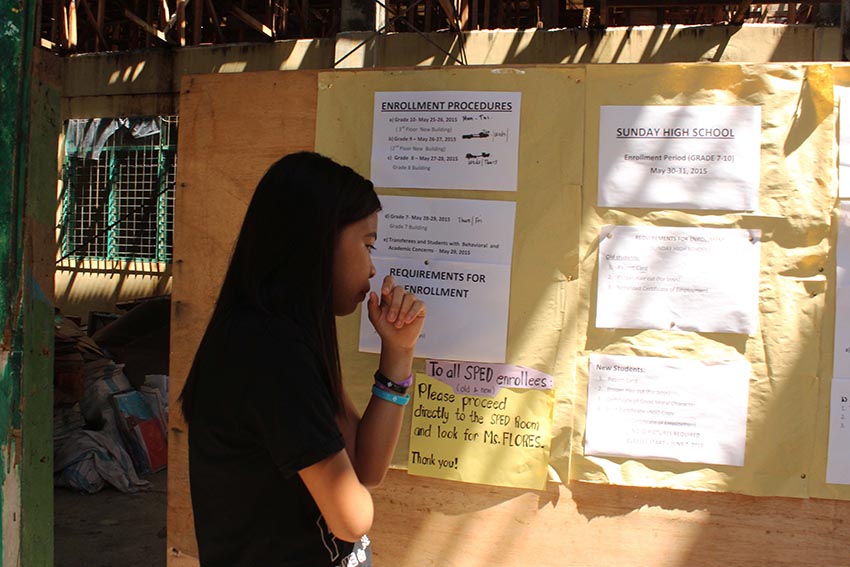 A Grade 10 student refers to the instructions posted in their school's bulletin board to know the procedures of enrollment.