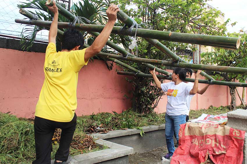 Two volunteers from House Keeping Department of one of the hotels in Davao City participated in Brigada Eskwela at Kapitan Tomas Monteverde Elementary School along C. Bangoy Street. (Medel V. Hernani/davaotoday.com)