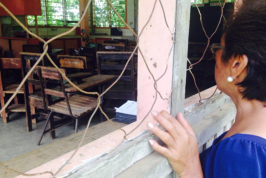 Wilma Acog, head of Tacunan Elementary School, shows their former canteen which was converted into a classroom last year due to lack of space. (Zea Io Ming C. Capistrano/davaotoday.com)