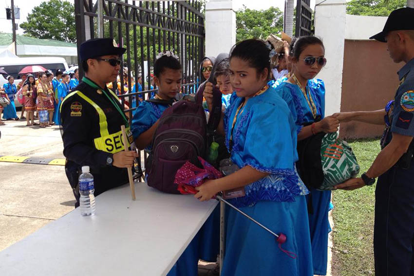 Even performers for the opening ceremony of the 2015 Palarong Pambansa submit themselves for inspections by security personnel guarding both the entrance and exit gates at the Davao del Norte Sports and Tourism Complex in Tagum City today. (Mart D. Sambalud/davaotoday.com)