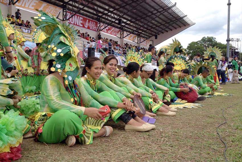 Performers from Department of Education Davao del Norte wait for their turn as the parade of athletes, coaches and guests are ongoing during the 2015 Palarong Pambansa opening ceremony. (Mart D. Sambalud/davaotoday.com)