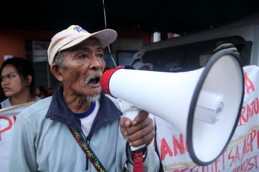 63 years old Melvin Bayancian, a Dibabawon-Mangowangan tribal elder in Sitio Bango, Barangay Ngan, Compostela, Compostela Valley Province calls for protest against the exploration of 12,000 hectares in the area. The Agusan Petroleum and Mineral Corporation has been granted mining rights in five barangays in Compostela. Settlers and tribal farmers demanded the cancellation of the exploration permit in a protest held in front the office of the Mines and Geosciences Bureau region XI on Thursday. (Ace R.Morandante/davaotoday.com)