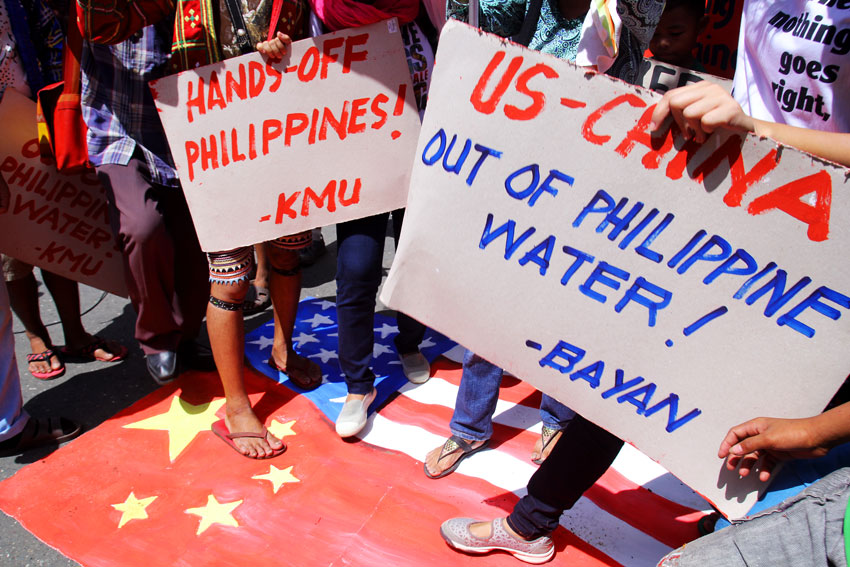    Militant groups stage a protest along San Pedro Street in Davao City against the intrusion of China and US in the Philippine waters during the 117th commemoration of the Philippine Independence day. (Ace R. Morandante/davaotoday.com)