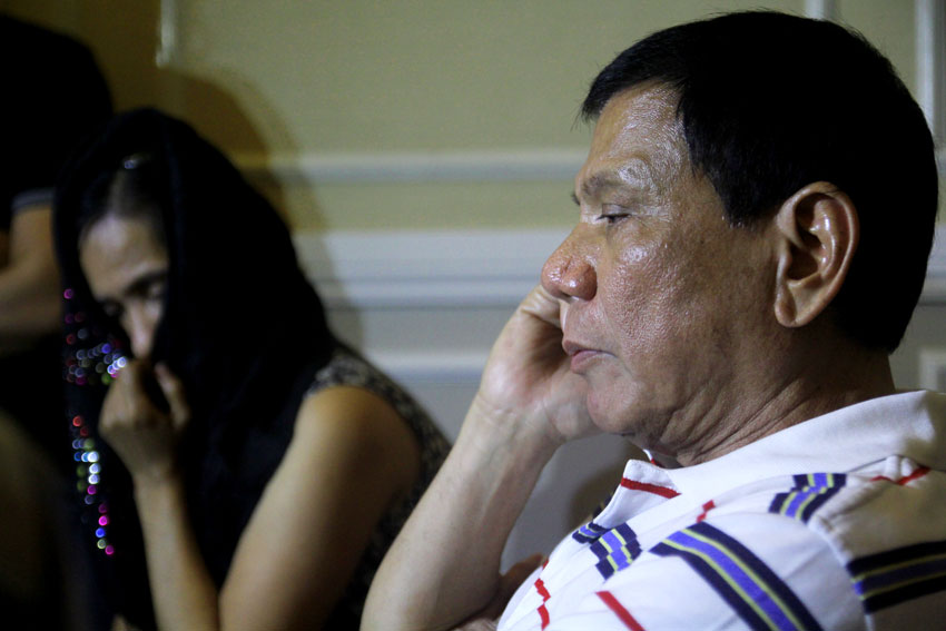 MOURNING. Mayor Rodrigo Duterte symphatizes with the wife of New People's Army commander Leoncio Pitao aka "Ka Parago"during his wake Monday evening at the Cosmopolitan Funeral. Duterte tells the military to declare a ceasefire during the wake of Ka Parago. (Ace R. Morandante/davaotoday.com)