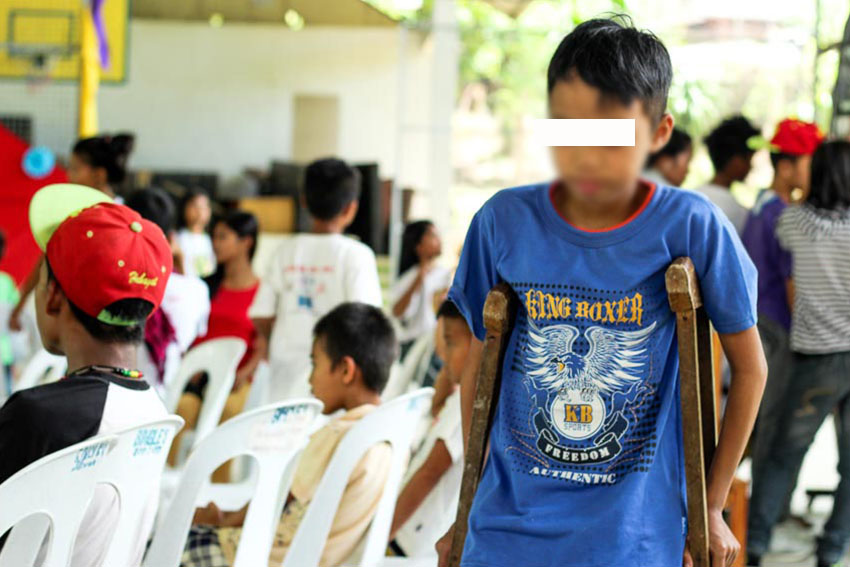 Tj (not his real name), 13, is a former child laborer who has been in crutches for about a year after sustaining an injury in his left ankle while working in the gold mines of Mt. Diwata in Monkayo, Compostela Valley Province. Tj used to earn P10  to P15 pesos for a day's work. (Paulo C. Rizal/davaotoday.com)