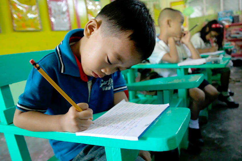 During the first day of school, students are asked to write their names as one of the requirements to be accepted in Grade 1. The children should also be able to read when they enter first grade. (Ace Morandante/davaotoday.com)