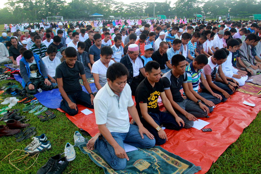 Hundreds of Filipino Muslims gather at Tionko Football Field at Agro Foundation College of the Philippines in Davao City to celebrate Eid'l Fitr to mark the end of month-long fasting during Ramadhan.(Ace R. Morandante/davaotoday.com)