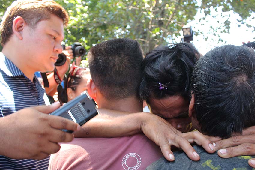 BRIEF REUNION. Perut Malibato, who is a tribal militia, is given the opportunity to talk to his family inside the evacuation center. Perut hugs his father Anayak Malibato and younger brother Alvin in an emotional encounter after they refused to go with him. 