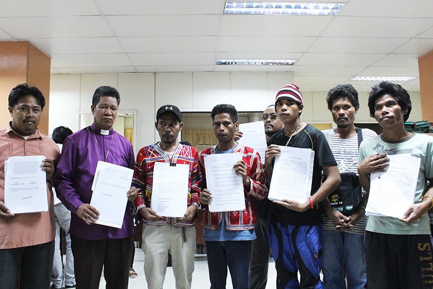 United Church of Christ in the Philippines Bishop Hamuel Tequis (second from left) and Manobo tribal evacuees inside the UCCP Haran compound in Davao City file seven charges against 20 respondents including North Cotabato 2nd District Representative Nancy Catamco, and high-ranking police and Army officials before the Department of Justice on Friday afternoon. (Medel)  