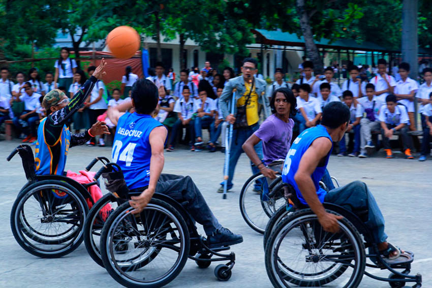 Persons with disabilities from various districts in Davao City play basketball in Davao City National High School court on Wednesday as they commemorate the 37th National Disability Prevention and Rehabilitation week that started last July 17 and will end on July 23. (Ace R. Morandante/davaotoday.com)
