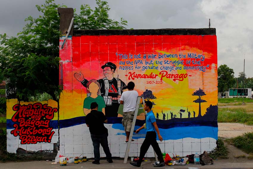 Davao artists volunteered to paint a mural of New People's Army commander Leoncio Pitao alias Kumander Parago along Matina higway in Davao City as their tribute to the fallen revolutionary. (Ace R. Morandante/davaotoday.com)