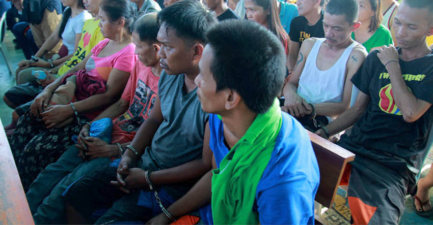 HANDCUFFED. Around 39 suspected drug pushers and users are caught in a simultaneous raid in Davao City by the combined elements of Davao City Police, Philippine Drug Enforcement Agency and Crime Investigation and Detection Group on Wednesday morning. (Ace R. Morandante/davaotoday.com)