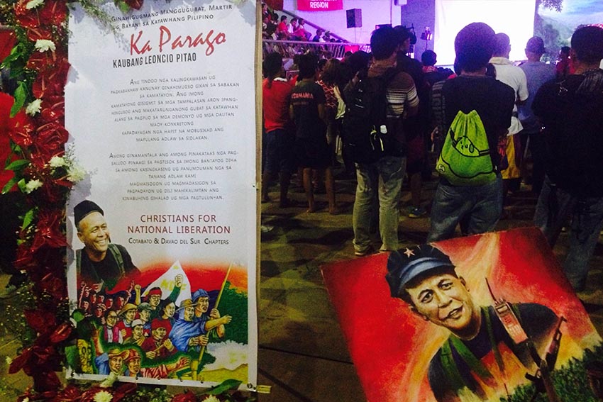 A statement from the Christians for National Liberations Cotabato and Davao del Sur chapters along with a painting by artist, Ruben De Vera, is displayed during the tribute night for New People's Army commander Leoncio Pitao. CNL is an underground organization affiliated with the National Democratic Front. (Zea Io Ming C. Capistrano/davaotoday.com)