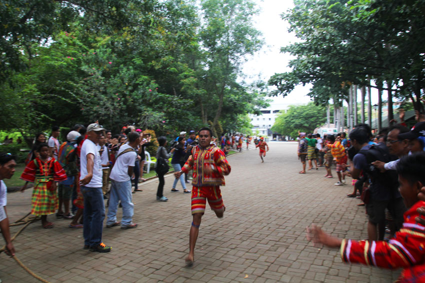 FINISH LINE. An Ata-Manobo wins the track and field competition in the People's Park. All of the players ran with bare feet during the game. 