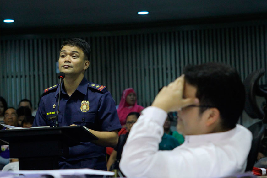 Chairman of the City Council Committee on Human Rights Councilor Karlo Bello (right) is unsatisfied with the explanations of Police Senior Inspector Nolan Genova of the Philippine National Police crime laboratory regarding the alleged massacre of three civilians in Paquibato District, Davao City last June 14. (Ace R. Morandante/davaotoday.com)