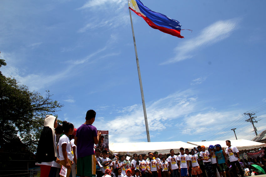 Alcadev students pay tribute to their school director Emerito Samarca at the Guingona Park, Butuan City.