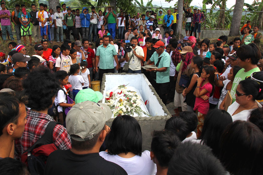 Emerito Samarca's casket is surrounded by thousands of people who paid their last respects during his funeral on Saturday.