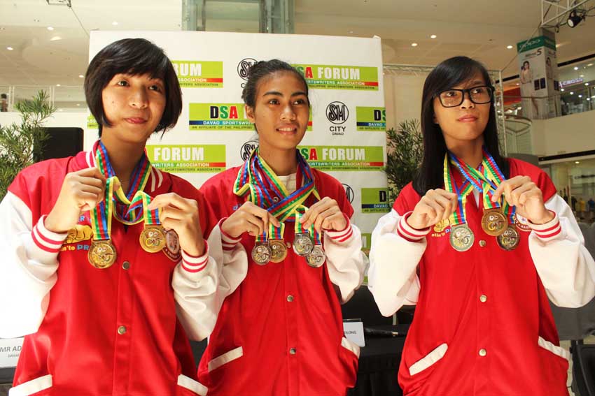Winners of the 2015 Philippine Olympic Committee-Philippine Sports Commission National Games chess competition at the Deped Teachers Center in Pagadian City, Zamboanga del Sur show their medals during the Davao Sportswriters Association forum on Thursday. (From left) Exiquila Apao, won a gold medal in the Blitz category; ZsuZsa Tabudlong, won three silver and one bronze, and Janes Hitfield Caingles, won silver in the Blitz category.(Medel V. Hernani/davaotoday.com)