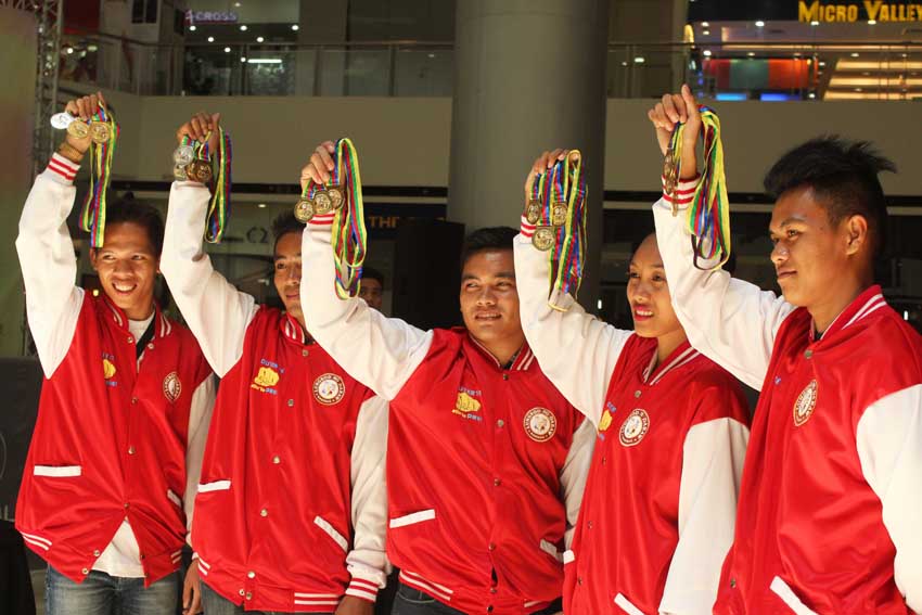 Davao City athletes  take home medals from the recently concluded 2015 Philippine Sports Commission National Games Mindanao Leg held in Pagadian City. From left is Sonny M. Wagdos who won a gold medal in the 5-kilometer run, a silver medal in 1.5-kilometer run, and gold in 4X400-meter event; Langie May Meder 22-year old won gold medals in the 100-meter dash, 200-meter dash and triple jump event; Adrian Linao, 24, also bagged three gold medals from three events; and Michel P. Barrosa who won two silver medals, a bronze and a gold medals in four events.(Medel V. Hernani/davaotoday.com)