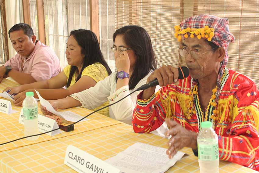 Claro Gawilan is joined by (from left to right) Reverend Sarly Templado of the United Church of Christ in the Philippines, Rev. Joy Mirasol, and Milagros Maglunsod-Tan of the Mindanao Integrated Services Foundation Inc. Academy during their presentation of the report from the three-day mission conducted in Kitao-tao, Bukidnon last week. The group said 55 families have already evacuated in Arakan Parish, leaving their farms unattended due to fear of being tagged as rebels or rebel supporters. (Medel V. Hernani/davaotoday.com)