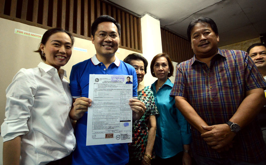 Davao City's first district congressman Karlo Alexei Nograles is the first politician to file his certificate of candidacy as first district representative today at the Commission on Elections office. He is escorted by his wife Marga (left) and other relatives. (Ace R. Morandante/davaotoday.com)