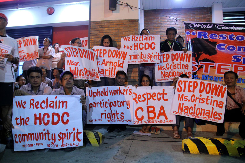 Instead of celebrating teachers day, teachers and employees unions of Holy Cross of Davao College stage a protest action outside the school against the implementation of a policy for employees that has threatened their security of tenure. (Ace R. Morandante/davaotoday.com)
