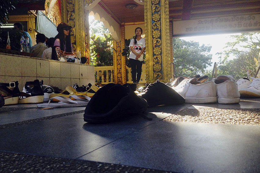 SHOES OFF. Worshippers and visitors of the Wat Phrathat Doi Suthep are asked to take off their shoes before entering the platform of the Golden Chedi.