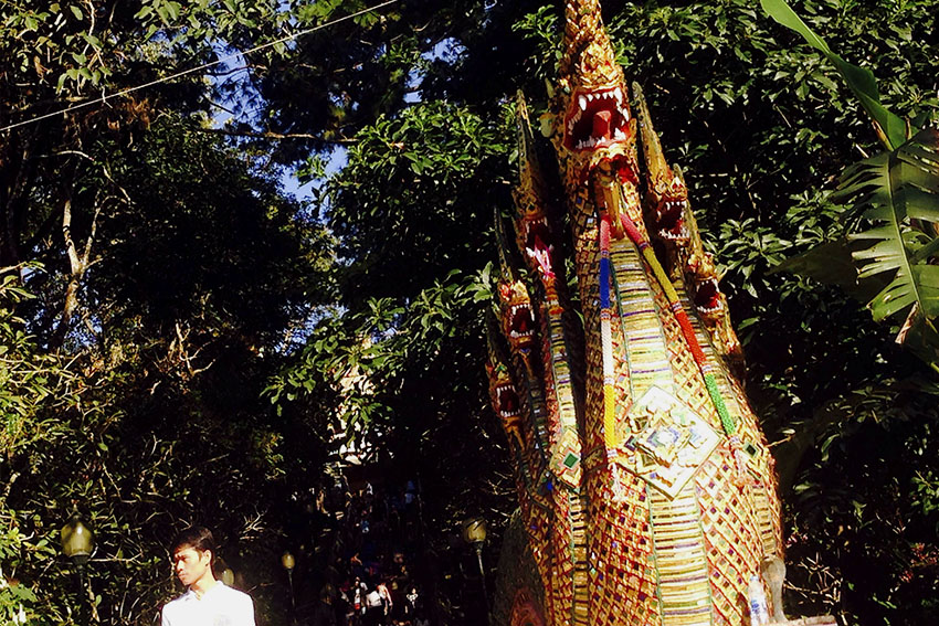 MYSTICAL SERPENTS. The five heads of the mystical serpents called Naga are seen at the entrance of the staircase that leads to Wat Phrathat Doi Suthep. In Buddhist mythology, the Naga is an underwater creature in the form of a serpent.